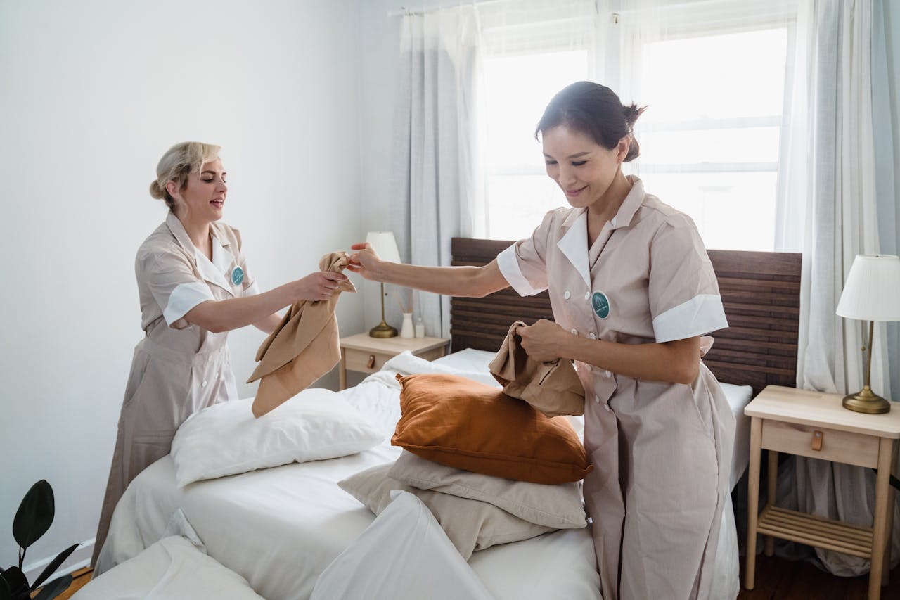 Carers cleaning a room